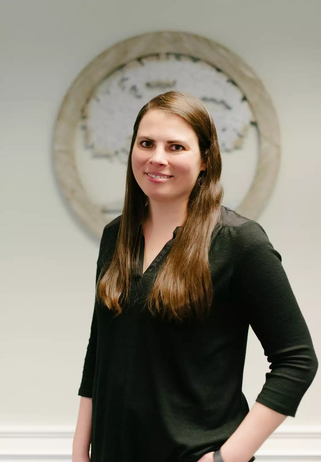 Portrait of Lauren, the owner of Living Tree Medical and a Registered Nurse, showcasing her professional demeanor and affiliation with the medical center.