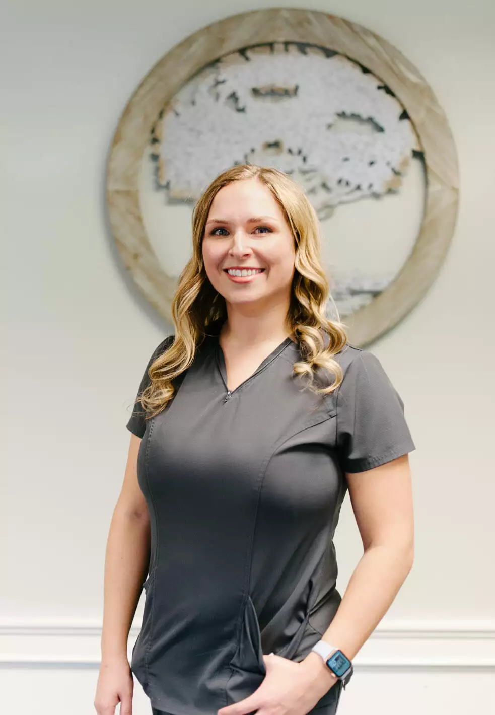 Professional portrait of Savannah Alder, a Family Nurse Practitioner at Living Tree Medical, in medical attire, representing her role and expertise in family healthcare.