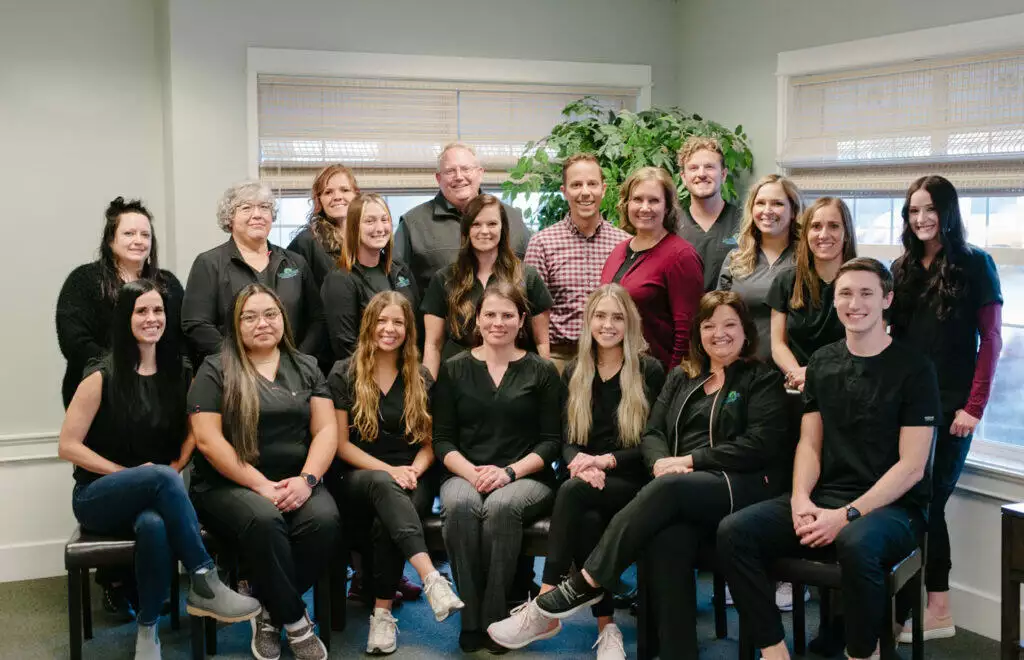 A group of staff posing for a photo at Living Tree Medical.