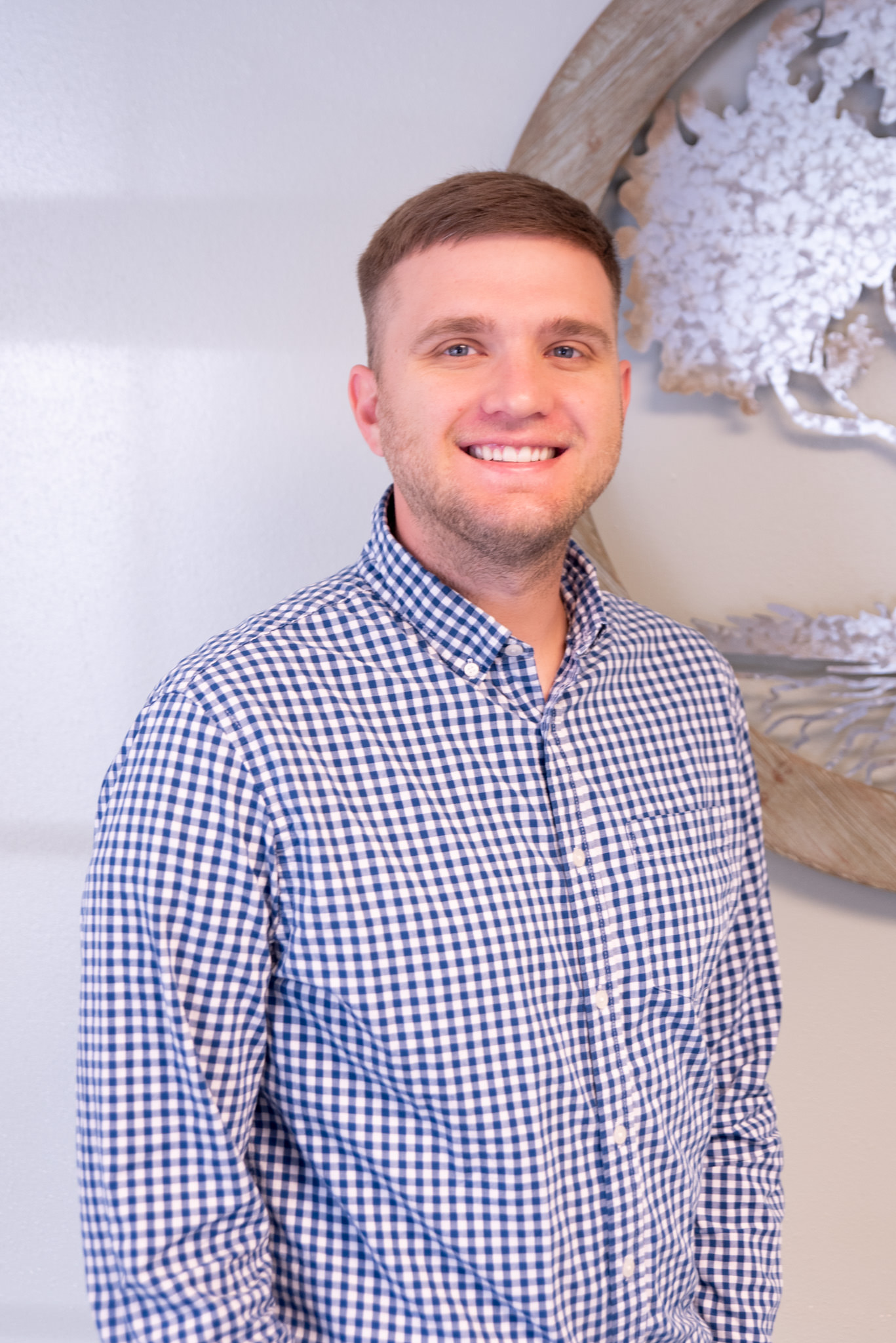 Professional portrait of Jackson Cheal, a Family Urgent Care doctor at Living Tree Medical, in medical attire, representing his role and expertise in family healthcare.
