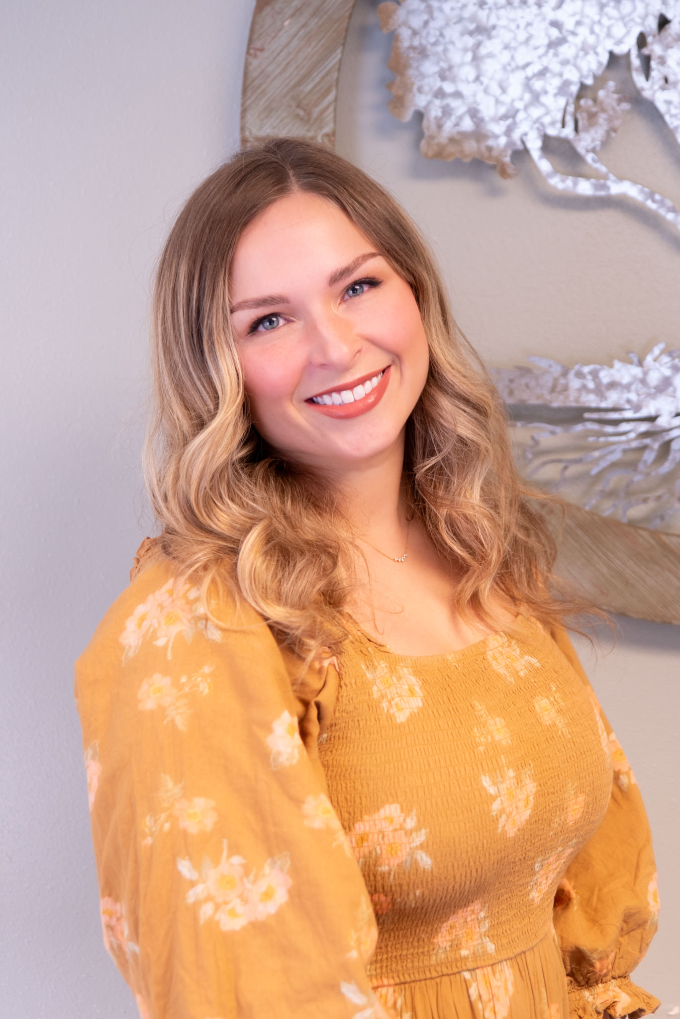Professional portrait of Savannah Alder, a Family Nurse Practitioner at Living Tree Medical, in medical attire, representing her role and expertise in family healthcare.